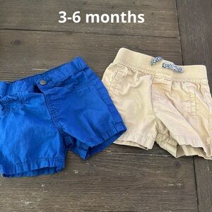 Two pair of baby shorts blue and Khakis . Size 3-6 months